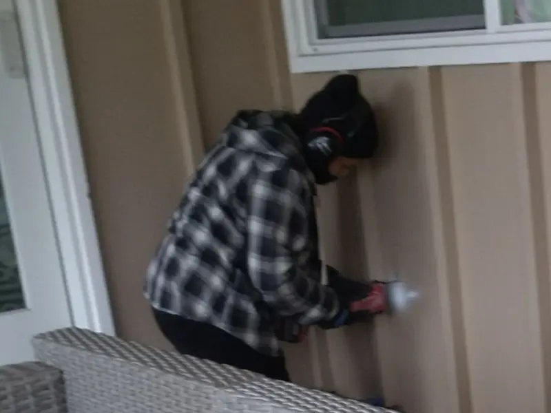Professional electrician installing an exterior outlet in Yakima