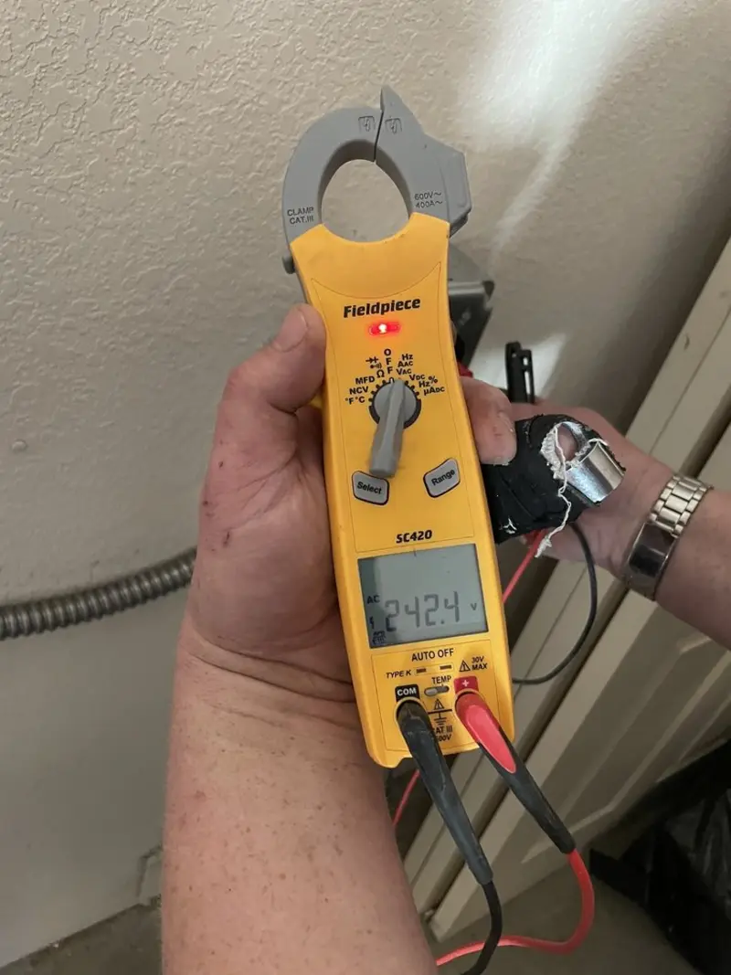 Voltage testing with clamp meter during Recessed Lighting Installation in Yakima